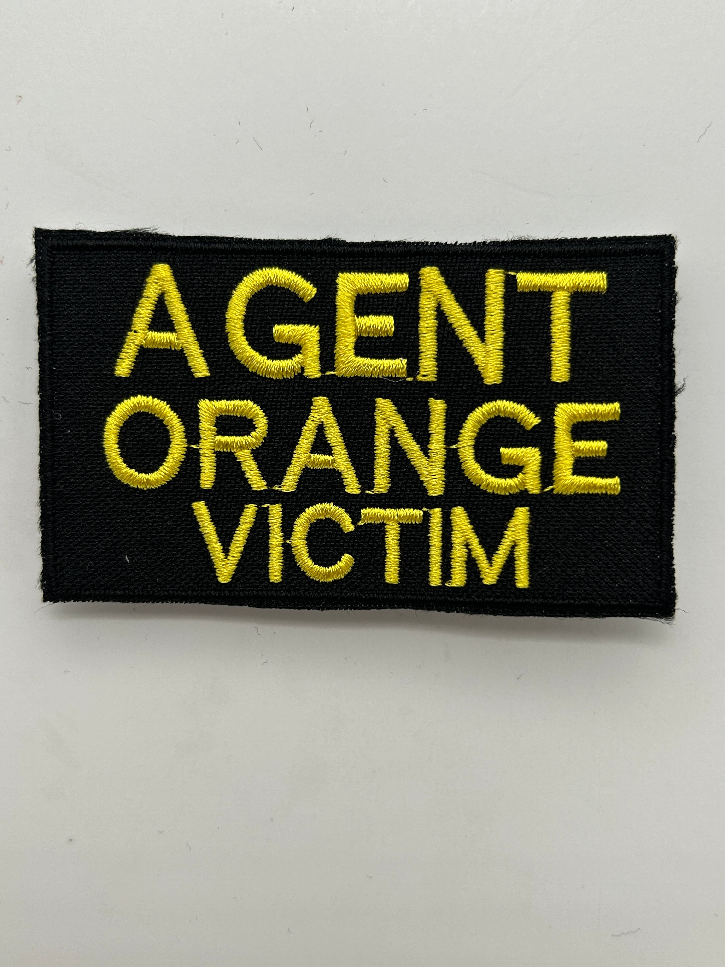 US Veteran Favorites "AGENT ORANGE VICTIM" Black Patch | Military Hats & Pins